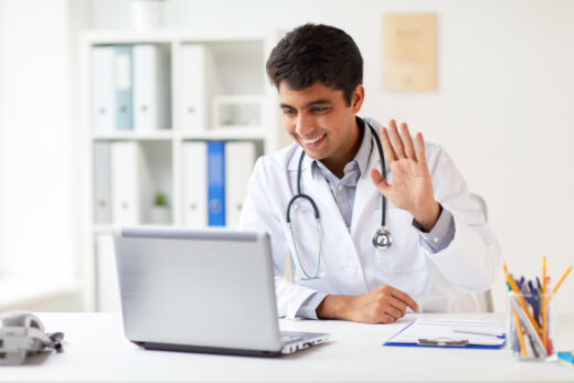 Doctor having video conference on laptop Doctor having video conference on laptop